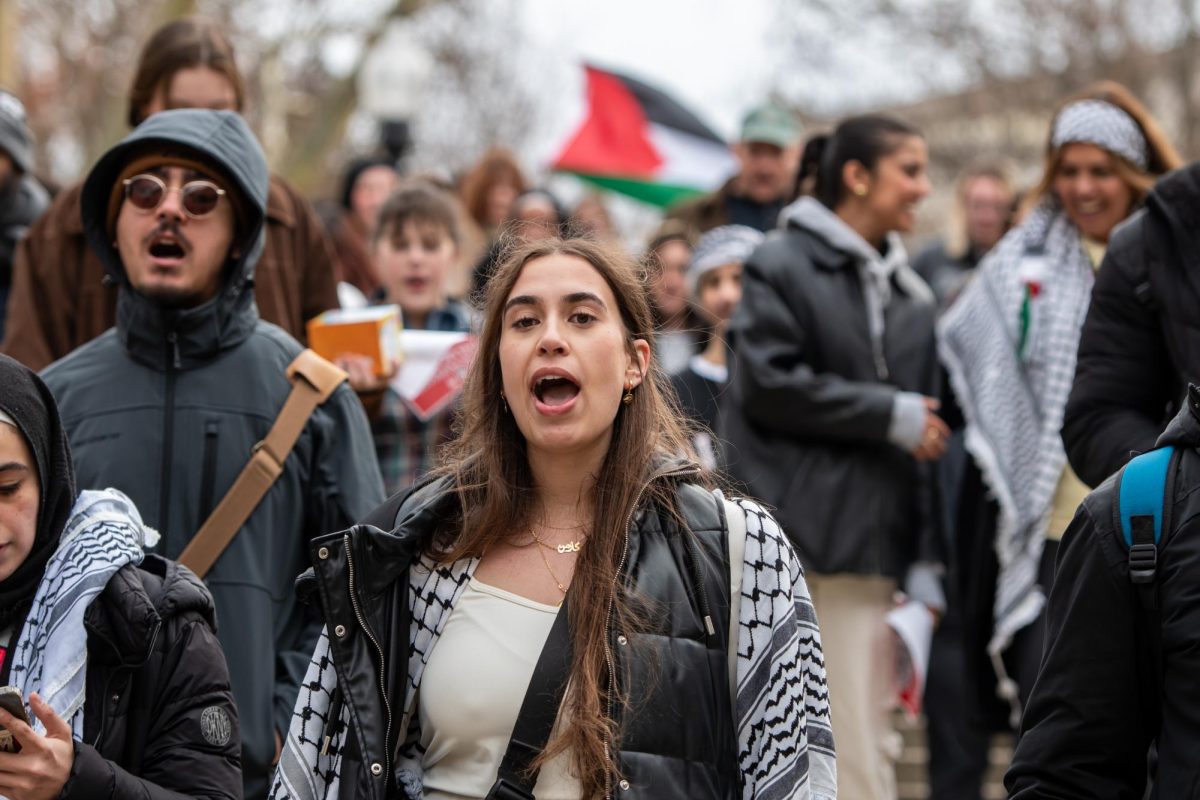 Kent State student Carmen Barghouty leads protesters in a march across campus during the Ceasefire Protest on Nov. 20, 2023.