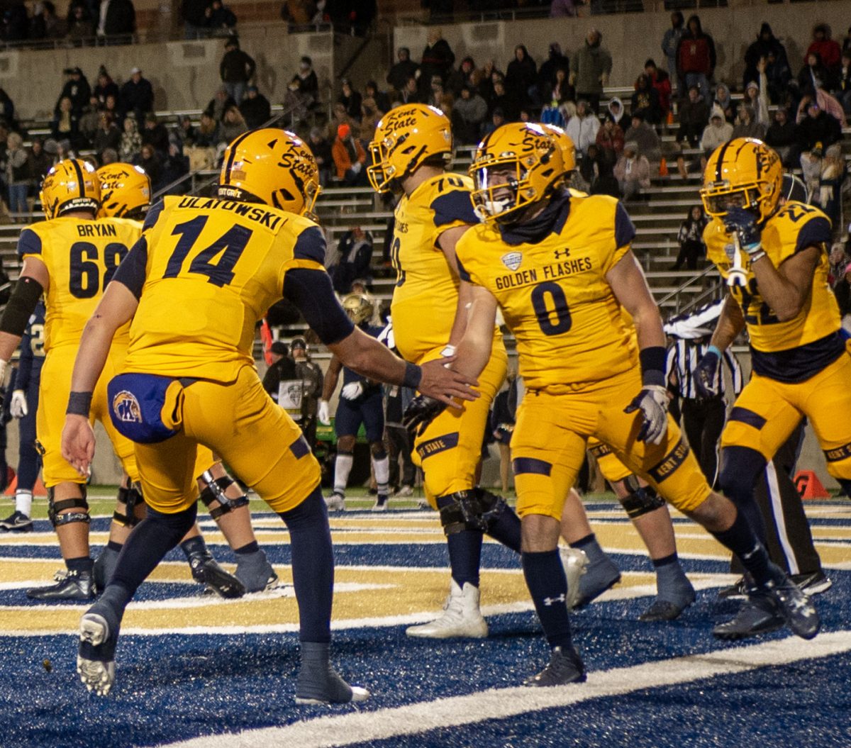 Kent State Sophomore Quarterback Tommy Ulatowski celebrates with Senior Wide Receiver Luke Floriea (0) after they connected for a 19 yard touchdown pass in the second quarter of the Wagon Wheel game at Akrons Infocision Stadium on Nov. 1, 2023.