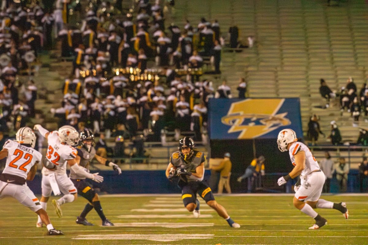 Kent State graduate student wide receiver Jack Coulson gains some yardage against Bowling Green State University during the game on Nov. 8, 2023. 
