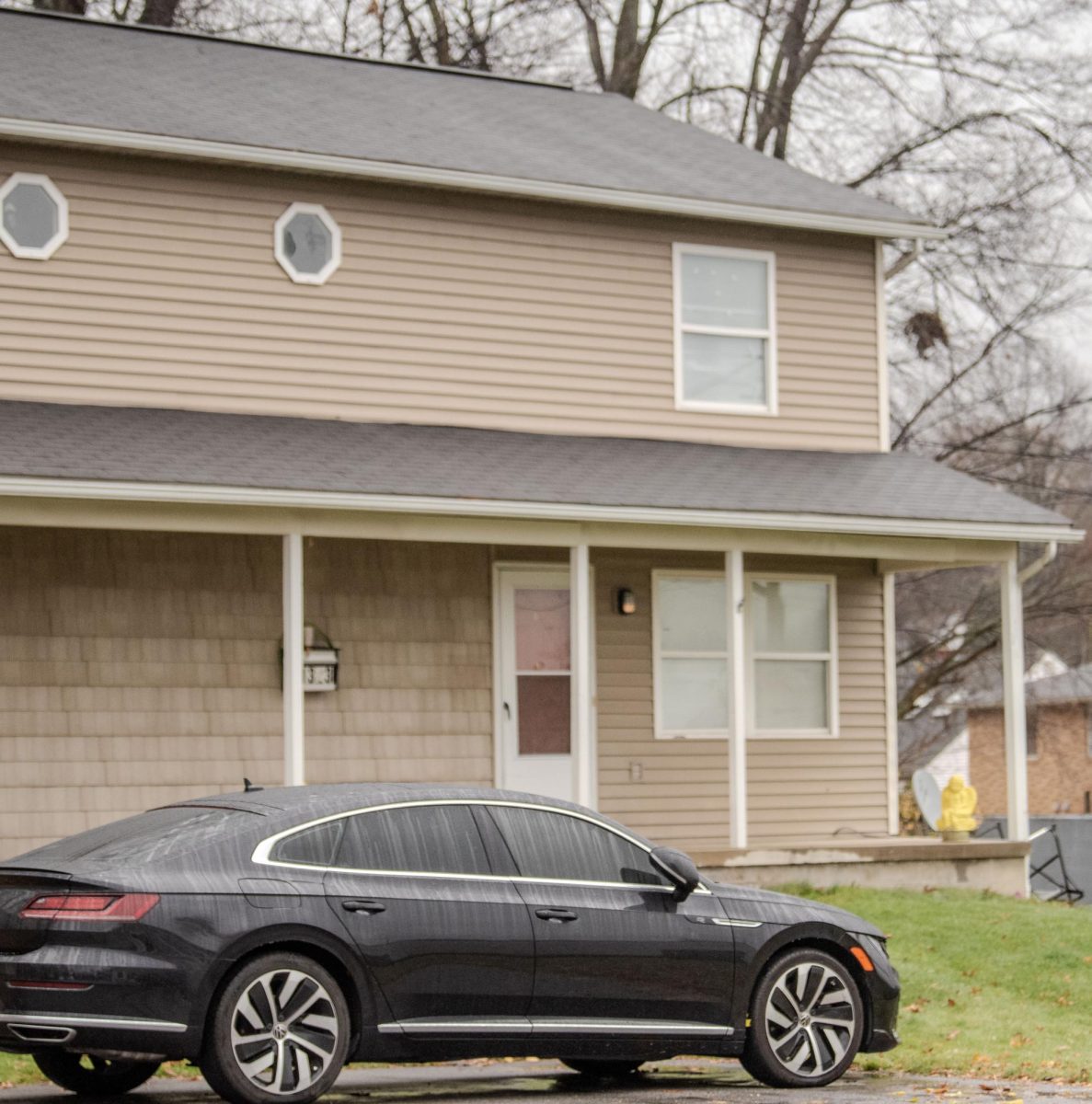 A car sits outside of the duplex where a 35-year-old woman was killed Nov. 21, 2023.