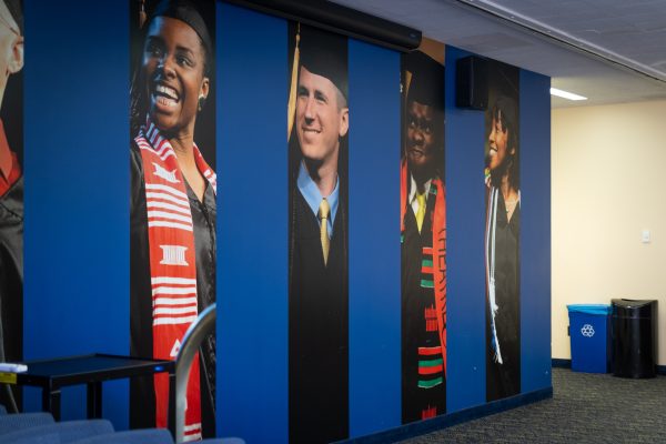 Images of graduates line a wall in the Student Multicultural Center on Nov. 11, 2023.