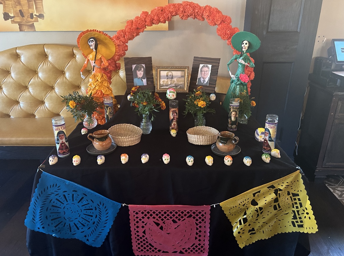 The Battlegrounds altar in the restaurant honors those who have passed on Día de los Muertos. 