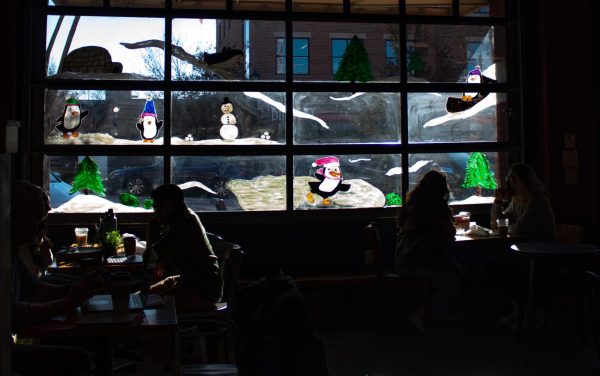 Tree City coffee shop gets into the holiday spirit with festive window art on Nov. 13, 2023.