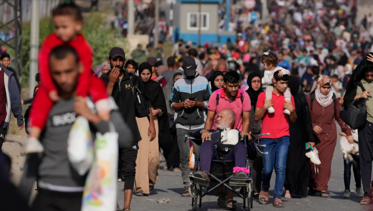 Palestinians flee to the southern Gaza Strip via Salah al-Din Street on Wednesday.