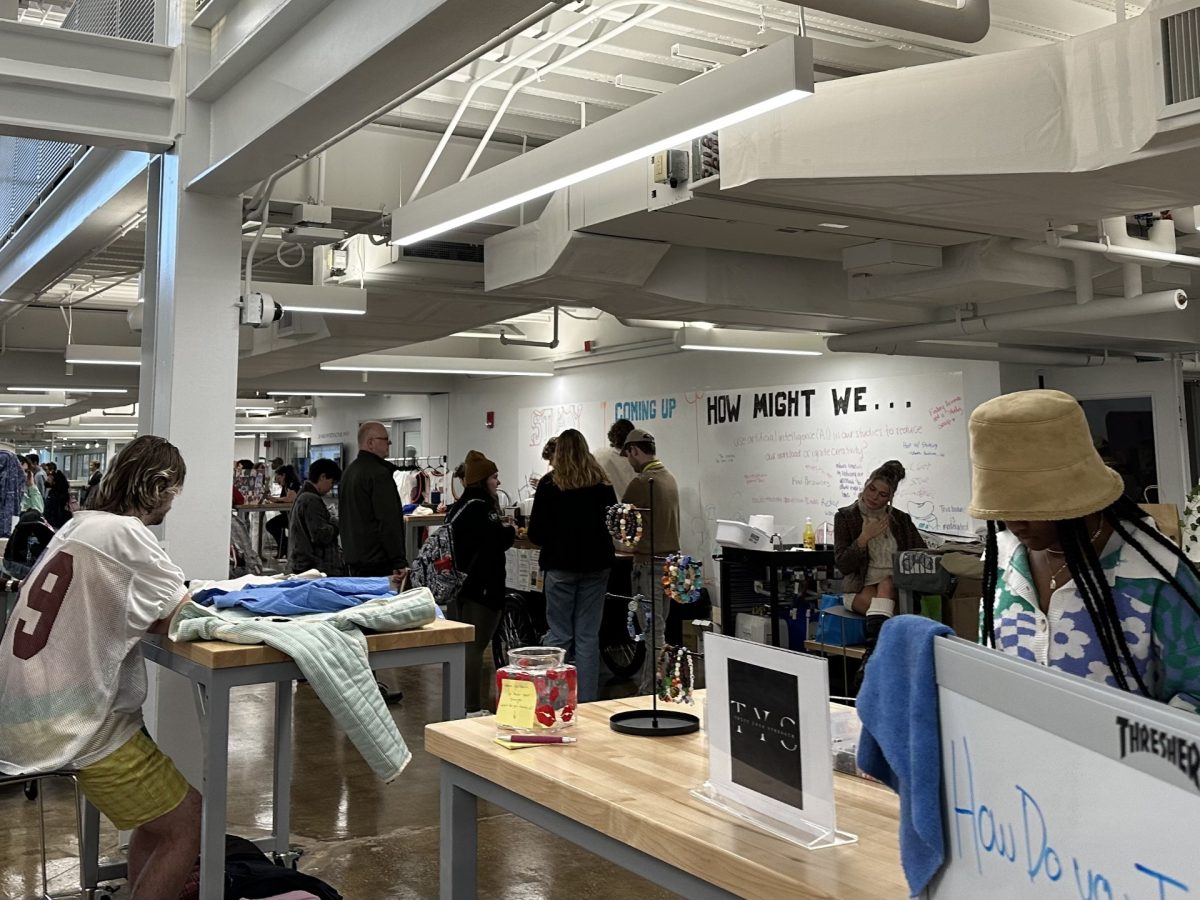 Student entrepreneurs participate in tabling at the Pitch & Ponder Showcase in the Design and Innovation Hub on Thursday. 
 
