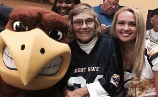 Maiju Mackey poses with Flash at a Kent State event.