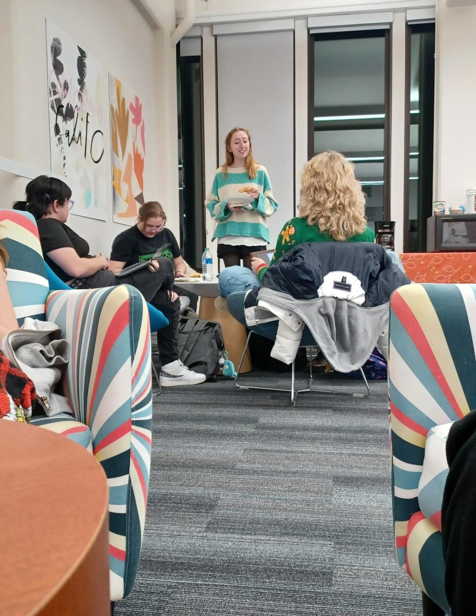 Students hanging out in the Taylor Hall Undergraduate Studio before the AIGA Wrap up the Semester event on Dec. 6, 2023. 