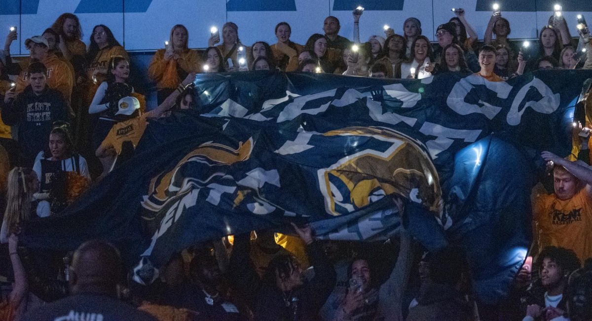 Before tipoff, the student section lights up the Memorial Athletic and Convocation Center with their cellphones and pass the giant banner welcoming the basketball team before the Akron game on Jan. 19, 2024.