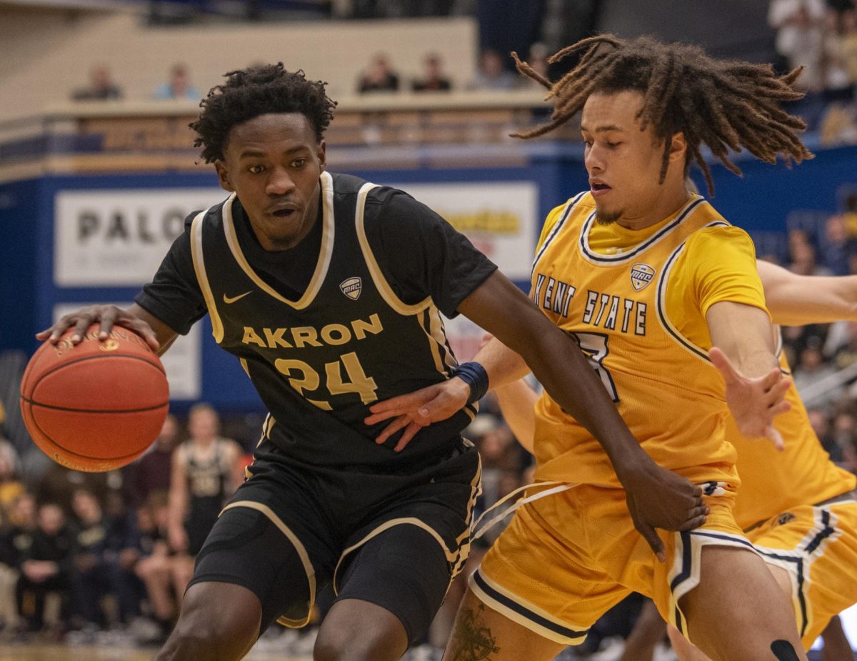 Akron guard Ali Ali attempts to drive by Kent State junior guard Jalen Sullinger early in the Zips 77-71 win over the Golden Flashes on Jan. 19, 2023. Ali scored 23 points, tying the game high with teammate Enrique Freeman.  