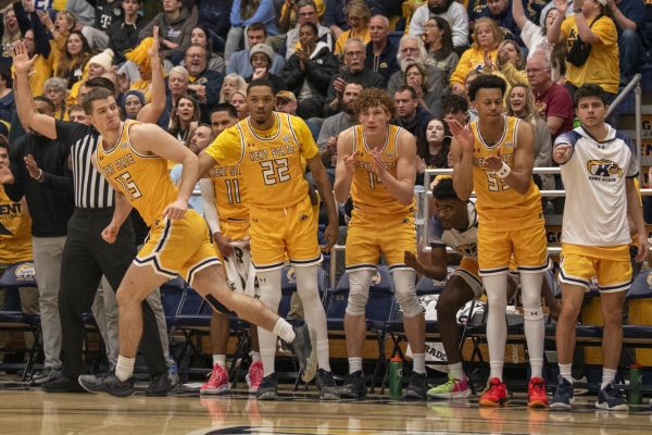 Kent State teammates congratulate junior guard Mike Bekelja following a made three-pointer during the Akron game on Jan. 19, 2024.