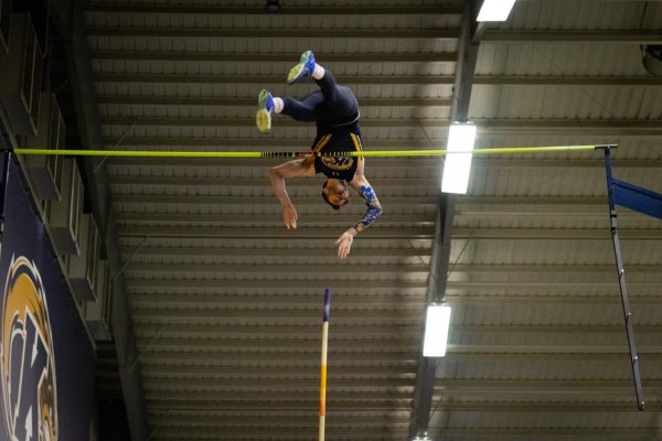 Senior Kristian Kneffler clears 17-3.50 in the track and field meet against Akron on Jan 19, 2024.  