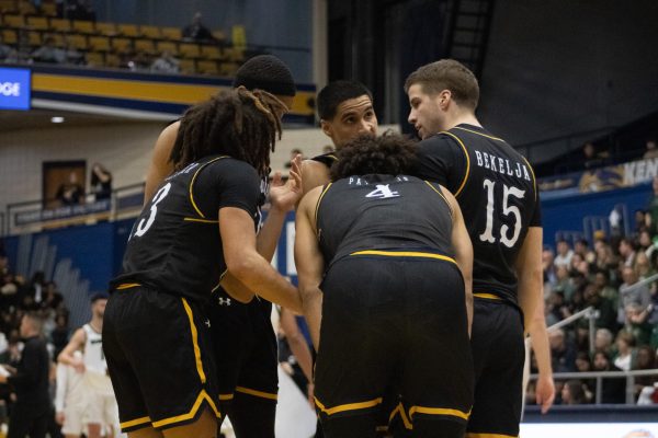 Kent State Mens basketball huddles during the second half of the game against Ohio University Jan. 26, 2024, where they lost 71 to 64. 
