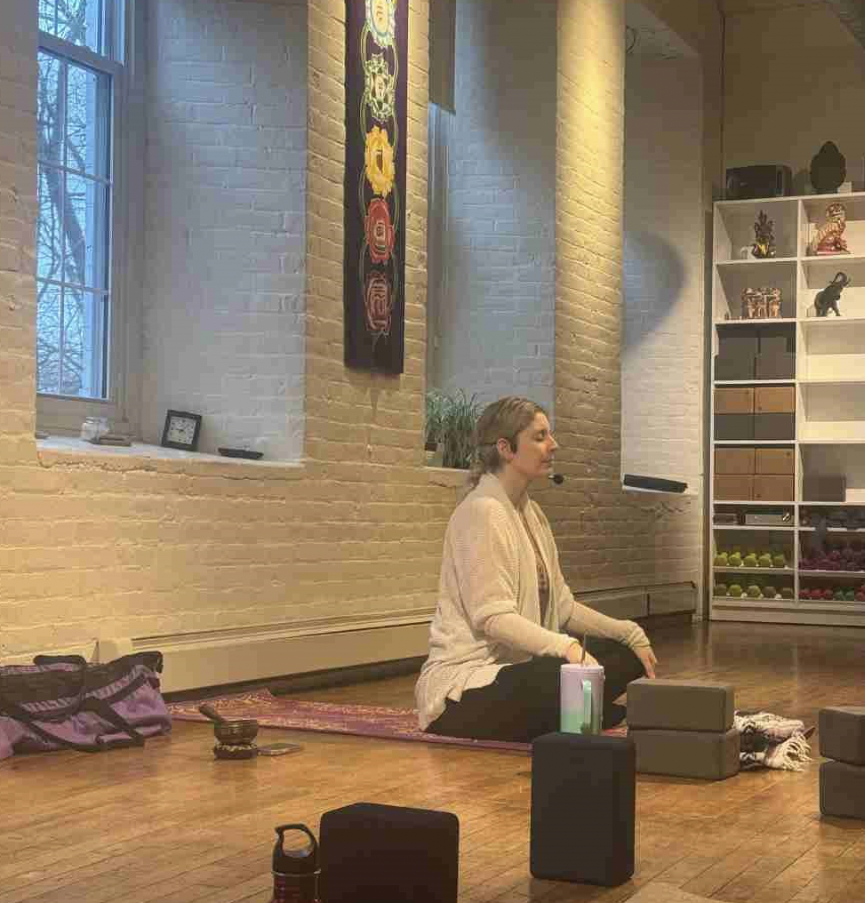 Instructor Nicole Lutz teaching Saturday morning basics yoga class at One Love Yoga.