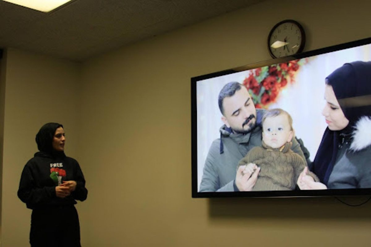 Sabreen Alshaikh, a graduate student from Gaza studying translation at KSU, presents photos of former friends and university colleagues and their families she had in Gaza who were killed in the war at the Lets talk about Gaza event on Feb. 15, 2024.