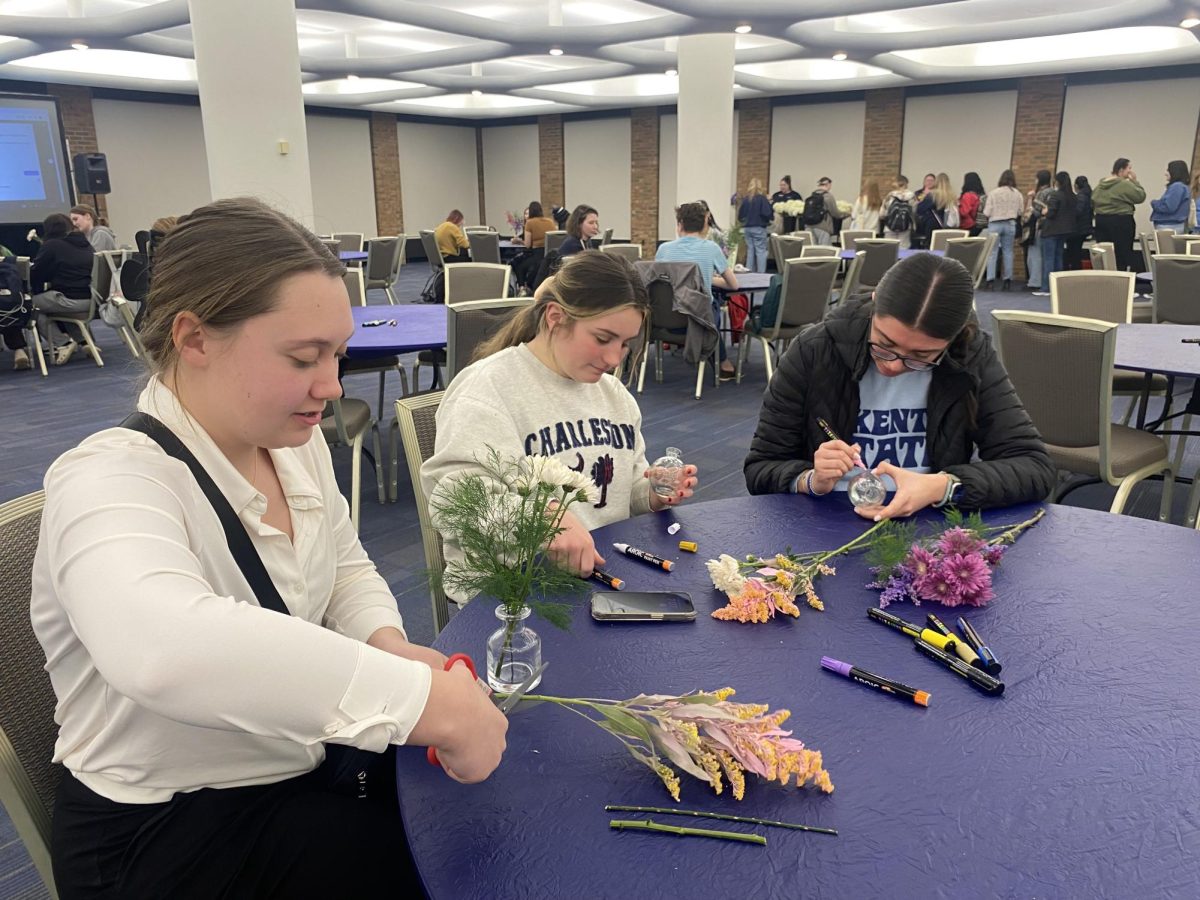 Brodie Sikorski, Ava Hirsch and Alexis Spears create bouquets of flowers at FABs bouquet making event.