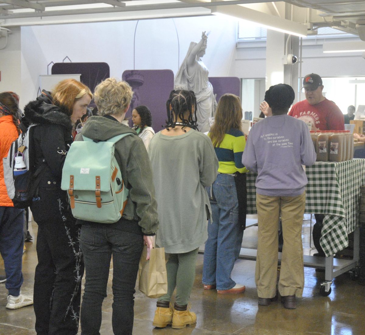 Students wait in line at the farmers market in the DI hub on Tuesday from 4-7 pm. 