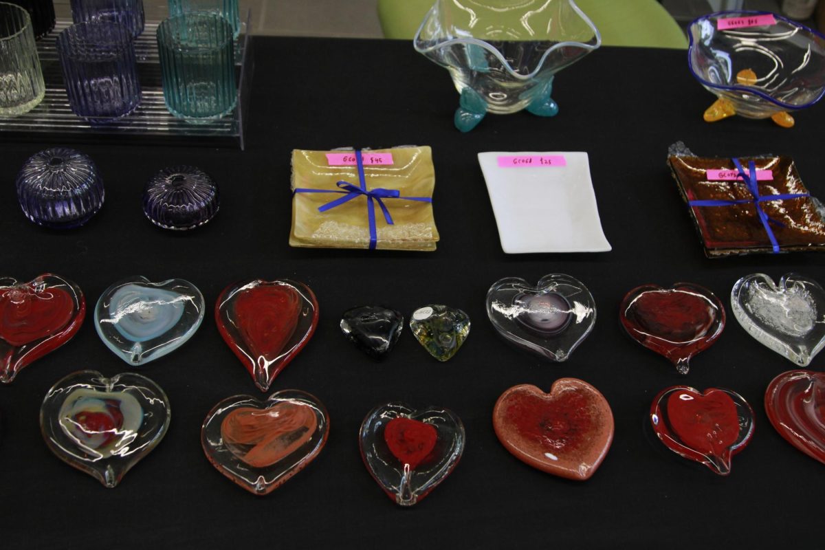 Handmade heart-shaped glass decor sits on display at Kent States Art Clubs annual Valentines Day sale Feb. 9, 2024 
