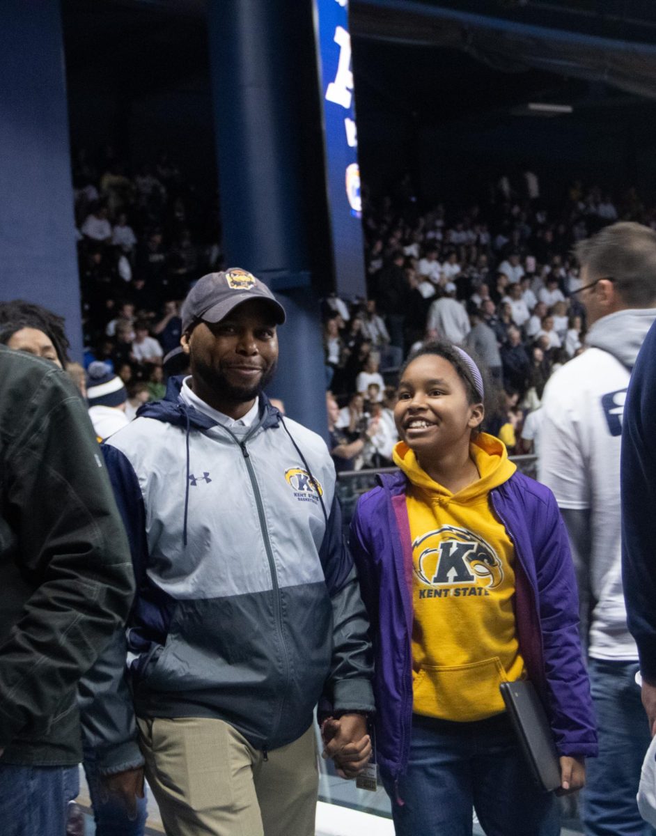 Randale Richmond attends the Kent v. Akron rivalry game with his family at Akron on February 23, 2024.