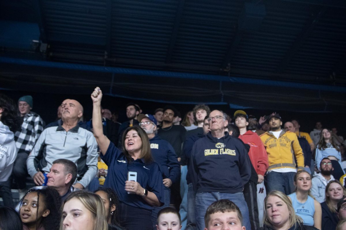 Attendees of the James A. Rhodes arena stand on February 23, 2024 in the finial moments of the Kent v. Akron rivalry game.