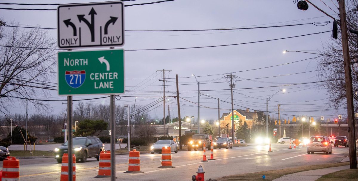 Traffic flows through the intersection at East Highland Road and Ohio Route 8, near where a tanker truck explosion happened on Jan. 27, 2024.  Orange barrels and cones block off one of the two turn lanes, signifying the stretch of Route 8 south under the Interstate 271 North interchange remains closed as of Jan. 31, 2024.  