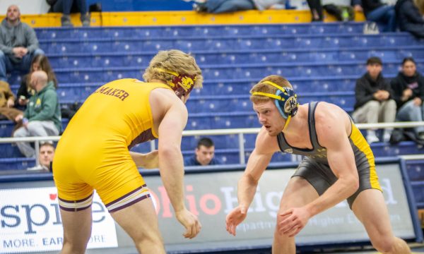 AJ Burkhart, Kent State graduate student, faces his opponent in the wrestling meet against Central Michigan University on Feb. 16, 2024.