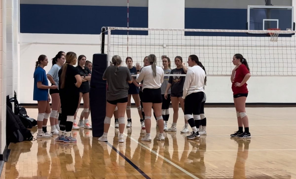 The womens club volleyball team meets ahead of a scrimmage Jan. 29, 2024.