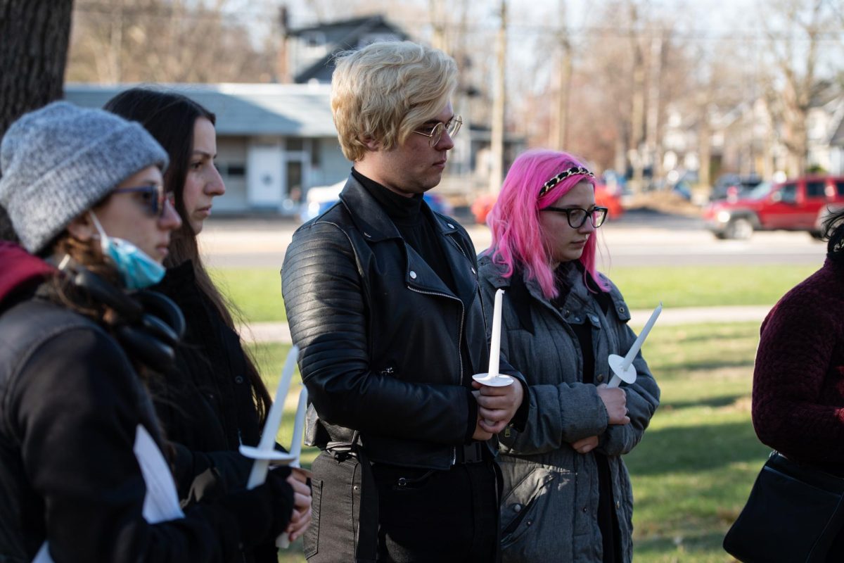 In memory of Nex Benedict, a non-binary teen who died in February, participants of the KSURGE Candlelight Vigil hold candles and observe a moment of silence on March 21, 2024.