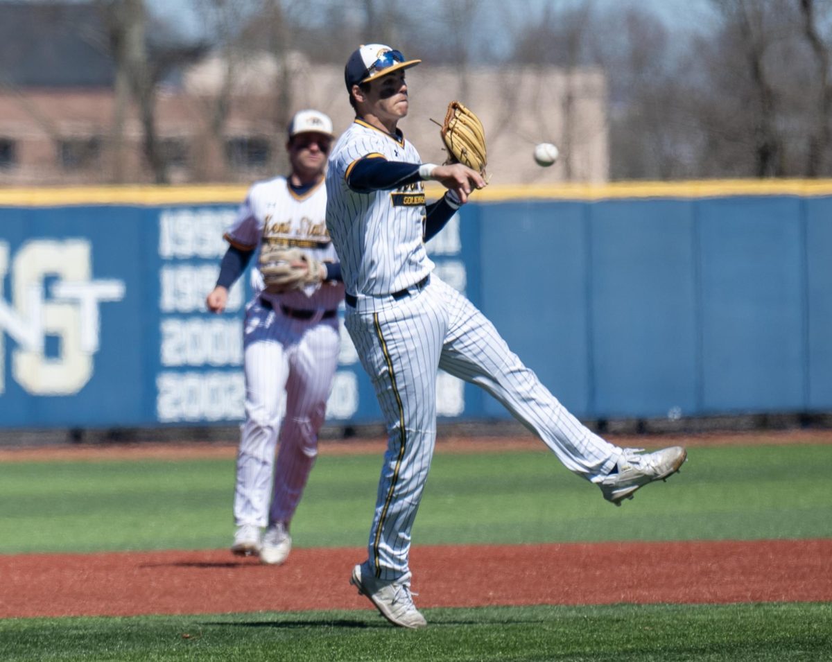 Kent State senior third baseman Kyle Jackson makes his throw across the infield to first base against St. Joseph during their game on March 24, 2024.