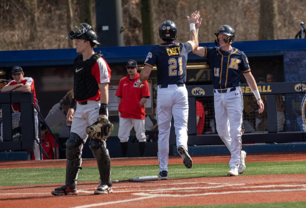 Junior+Left+Fielder+Jake+Casey+and+Kolton+Schaller+high+five+right+after+both+score+on+a+Reese+double+during+the+Golden+Flashes+27-0+blowout+of+Youngstown+State+on+March+12%2C+2024.