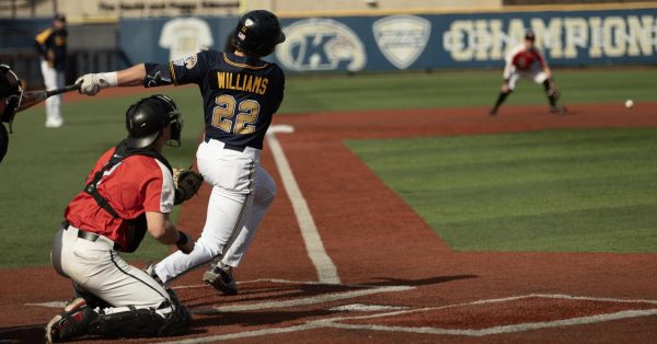 Catcher Brody Williams makes solid contact but grounds out to Youngstown State Third Baseman Matt Thompson in the second inning of the Golden Flashes 27-0 blowout of Youngstown State on March 12, 2024.
