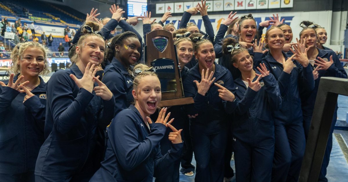 The+Kent+State+gymnastics+team+celebrates+their+10th+Mid-American+Conference+Regular+Season+Championship+following+their+meet+with+Bowling+Green+on+March+17%2C+2024.+Their+last+championship+came+in+2022.