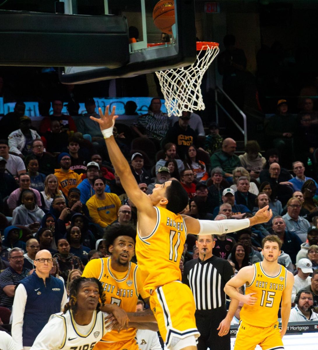 Kent State redshirt senior Giovanni Santiago makes a layup in the championship game against Akron at the MAC Mens Basketball tournament on Saturday, March 16, 2024. 