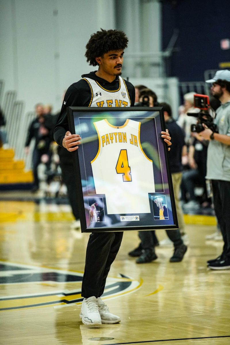 Senior Chris Payton Jr receives his framed jersey ahead of the seniors last home game on March 2, 2024.