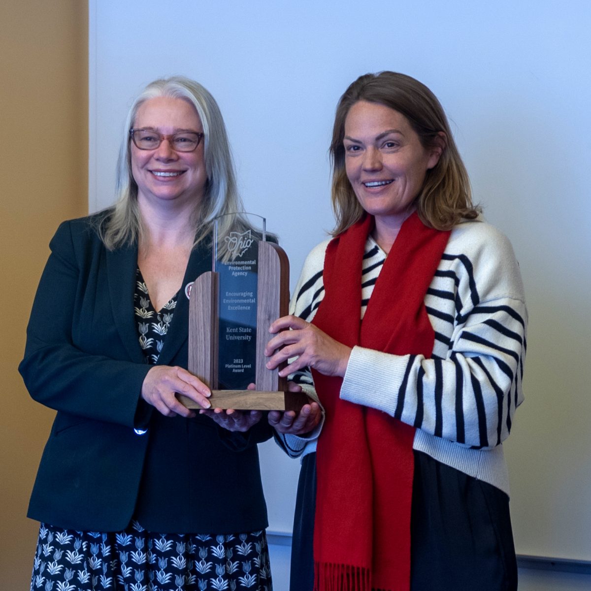 Anne Vogel (right), director of the Ohio EPA, presents a Platinum Award for Encouraging Environmental Excellence to Melanie Knowles, Kent State Sustainability Manager on March 19, 2024