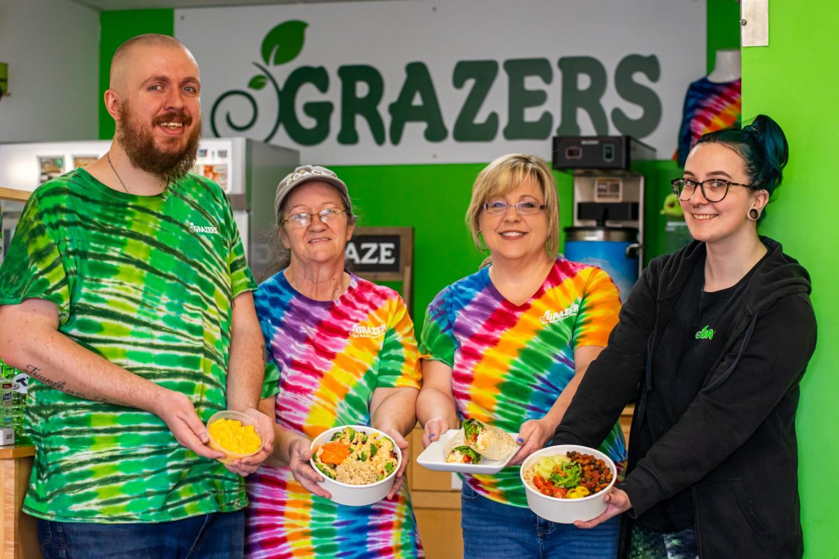Grazers employees show off some of the dishes available at Grazers.