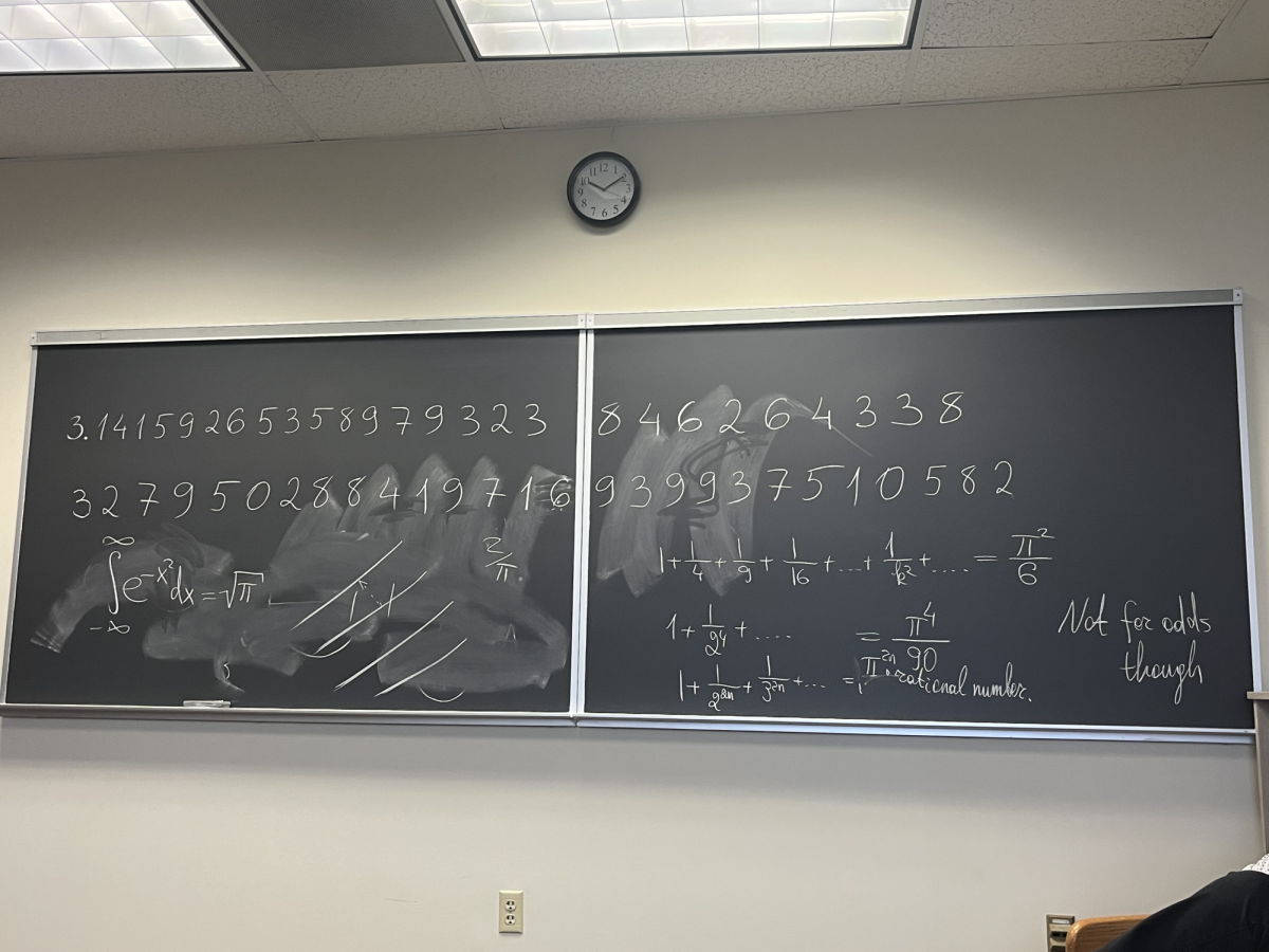 A chalkboard in the Mathematical Sciences building displays many of the infinite numbers of pi. 
