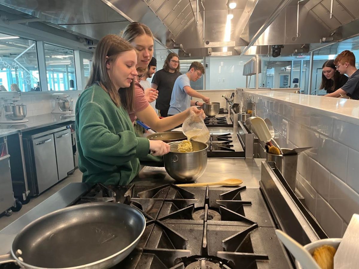 Students in French Elementary II mix ingredients for their crêpes in the Design Innovation Teaching Kitchen on March 4, 2024. 