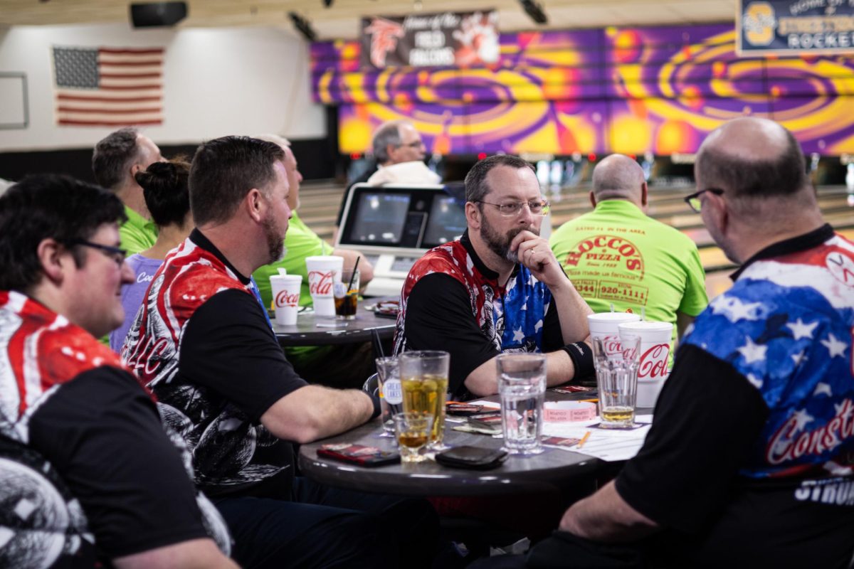 O Boy Construction team, a part of the Kent Classic Bowling League, sits together at Kent Lanes on March 21, 2024.