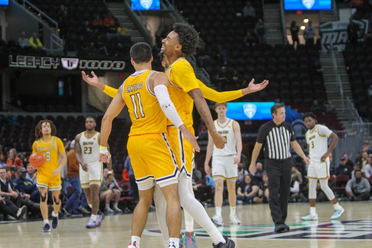 Julius Rollins and Giovanni Santiago celebrate after scoring against the University of Toledo on March 14, 2024