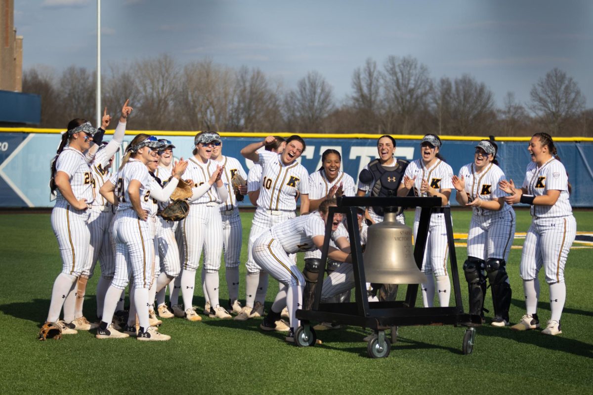 Kent State softball team rings the bell after a victory against Youngstown on March 13, 2024.