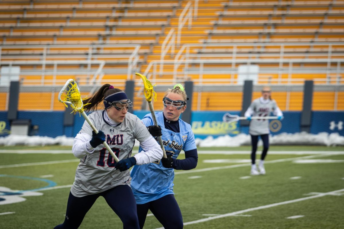 Meghan Haddow, Kent State defender, attempts to get the ball back from Robert Morris player on March 23, 2024.