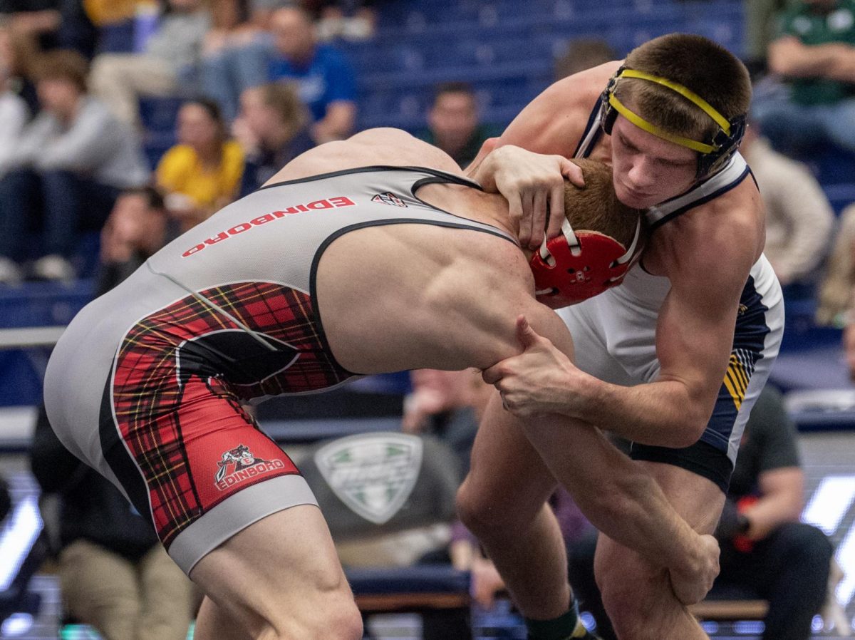 Edinboros+Jack+Kilner+tries+to+pull+out+Blake+Schaeffers+leg+for+a+takedown+during+their+Mid-American+Conference+quarterfinal+match+on+March+8%2C+2024.