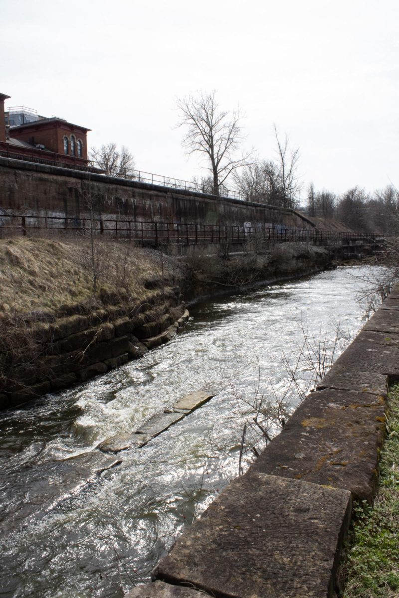 A stream of the Cuyahoga River runs parrel to the railroad tracks located in downtown Kent on March 8, 2024.