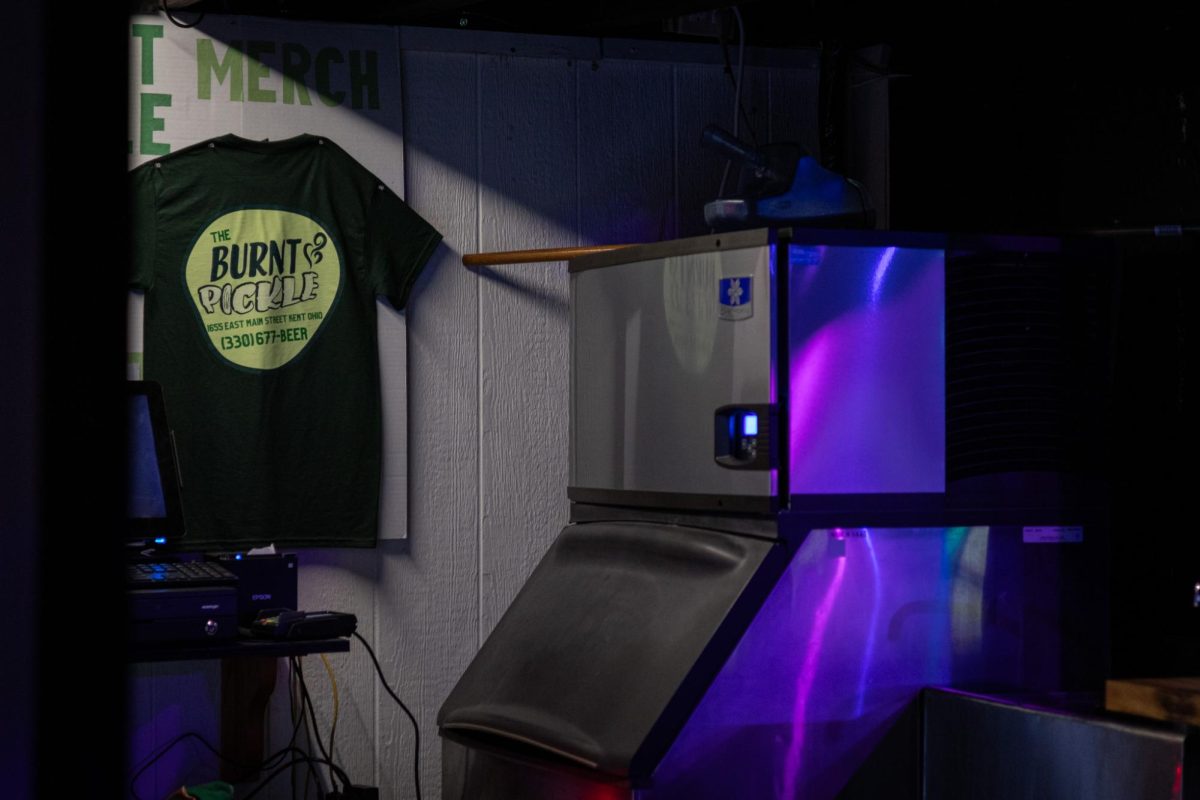 A Burnt Pickle tee-shirt is displayed at the bar of the same name on March 20, 2024.