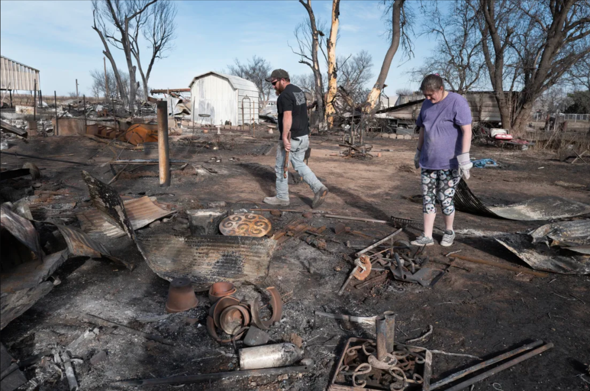 Tia+Champion+and+her+husband+Tim+help+a+friend+search+the+remains+of+her+home+near+Stinnett%2C+Texas%2C+after+it+was+destroyed+by+the+Smokehouse+Creek+Fire.