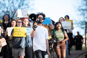 Christian Heller, a member of USAS, leads the protest speaking out against Kyle Rittenhouse coming to Kent State on a march to the Rock April 15, 2024.
