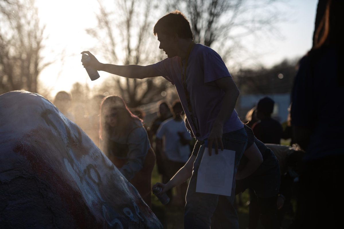 Participants of the protest speaking out against Kyle Rittenhouses campus visit paint the Rock April 15, 2024.