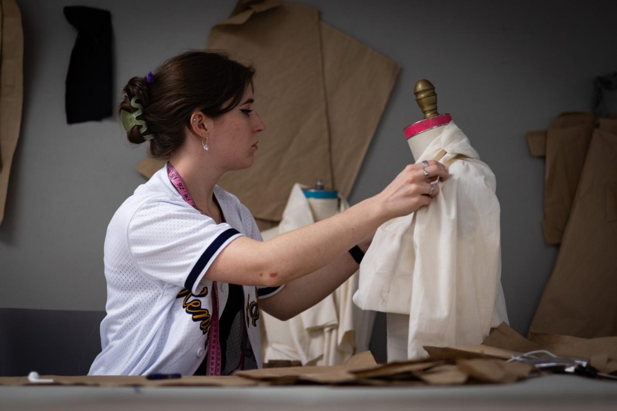 Allison Atkinson, junior fashion design major, works on a jacket at Rockwell on April 18, 2024.