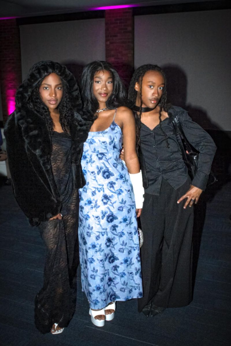 Kent State students Ziyaan Nurruddin, Jakari Singleton, and Anthony Richardson attends the reception for the 2024 Kent State Annual fashion show after walking in the show April 27, 2024.