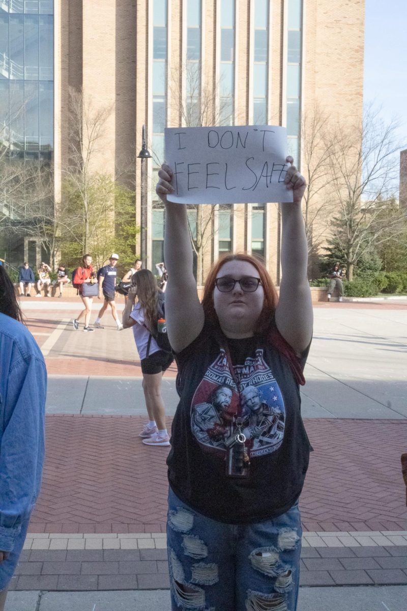 A protester holding up a homemade sign on April 16, 2024 out of the KIVA at Kent State University.